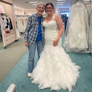 Brand new wedding dress, size 14, never altered